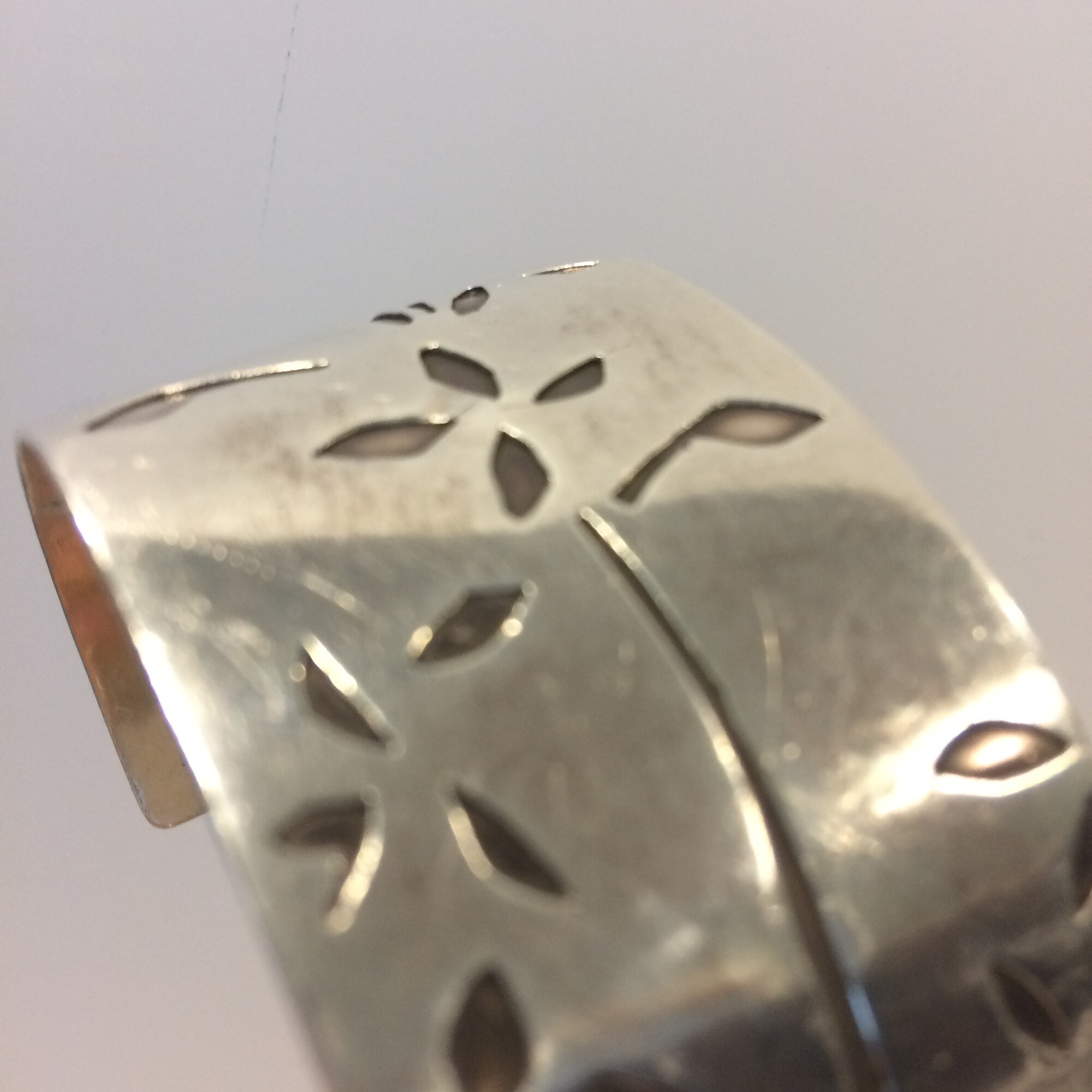 Silver cuff. Petal design cut out, hand pierced.