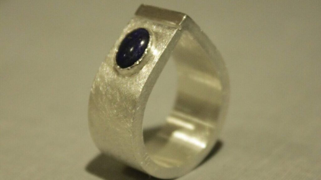 Teardrop shaped silver ring, blue stone
